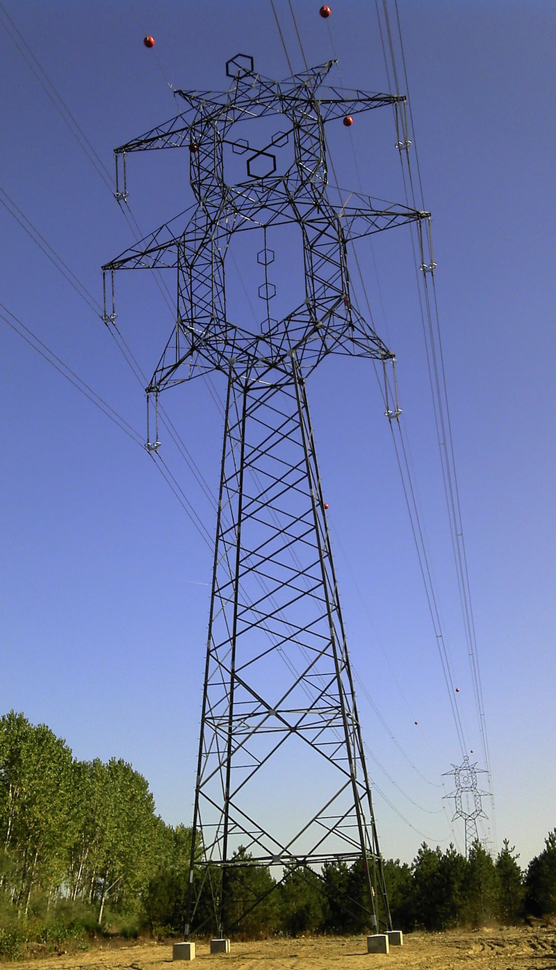 Illustration for article titled These Beautiful Giant Sculptures Support Power Lines With Style